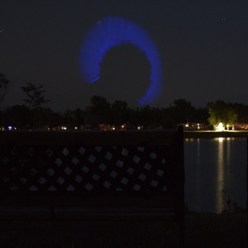 Exposure stack of a glowstick shadowed by a person